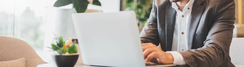 Businessman typing on his laptop