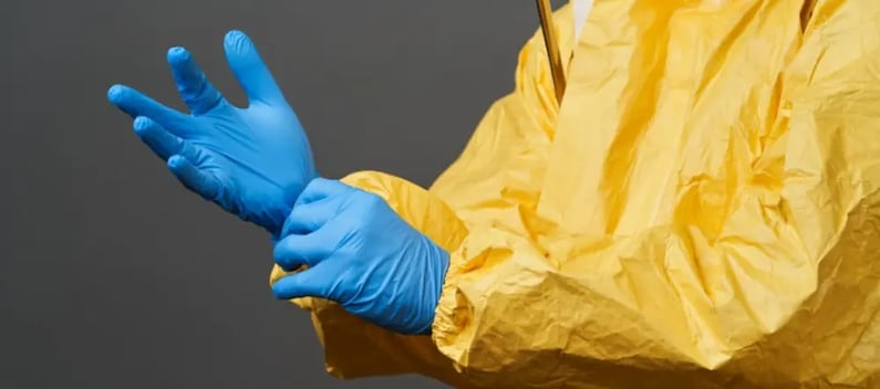 Person putting rubber gloves on