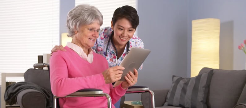 Healthcare worker showing patience with elderly patient