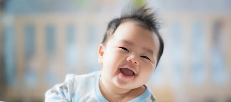 Signs of autism baby smiling