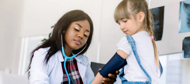 Paediatric doctor with young patient