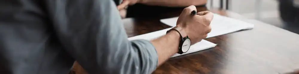 bg-two-people-table-unsplash, aed, aed meaning, what does aed stand for, what is aed, aed defibrillator, aed training, aed first aid, what is aed training, cpr aed training online, skills for care endorsed provider